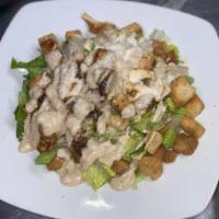 Chicken cesar salad  · Green salad with Caesar dressing and cheese. 