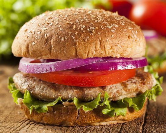 Classic Turkey Burger Deluxe · Fresh turkey patty made with fresh lettuce, tomatoes, onions, and customers choice of dressing! Served with fries.