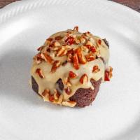 Praline Double Chocolate Brownie · Double chocolate brownie topped with praline sauce and pecans.