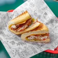 Turkey Bacon Ranch Panini · Turkey, bacon, cheddar cheese, tomato, pickles, pepperoncini & ranch dressing.