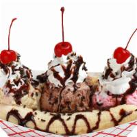 Banana Split · A banana with three scoops of ice cream, whipped cream, chocolate syrup, sprinkles and cherr...