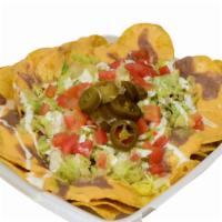 38. Nachos Supreme · Ingredients: nacho chips, nacho cheese, beans, lettuce, your choice of meat, tomato, sour cr...