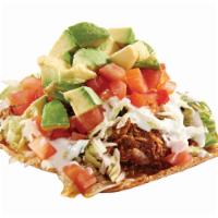 44. Tostada de Tinga (Spicy) · Shredded chicken in our house special sauce, beans, lettuce, tomato, avocado and sour cream....