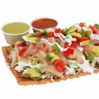 46. Chilindrinas · Served with beans, cueritos, cabbage, tomato, sour cream, avocado, and Valentina sauce.