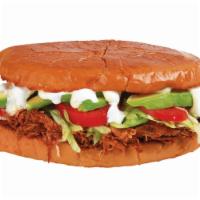48. Torta de Tinga - Spicy · Shredded chicken in our house special sauce, beans, mayo, lettuce, tomato, avocado, sour cre...