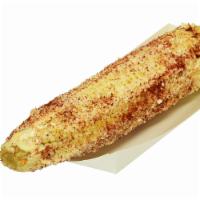 Elote Entero · White Corn in the Cob with mayo, Sour Cream, Parmesan cheese, Hot or Mild  Chile and Lime.
