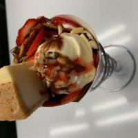 Cheesy Volcano · Cheese cake, vanilla ice cream, strawberry, almond, nutella, whipped cream, strawberry syrup...