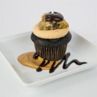 Goody Gracious Cupcake · Chocolate cake, peanut butter cream cheese frosting with a piece of chocolate chip cookie an...