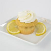 Lemon Doodle Cupcake · White cake, snickerdoodle cookie baked on top with lemon buttercream.