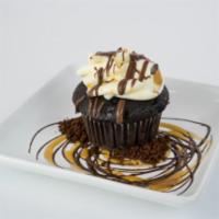 The Intern Cupcake · Chocolate cake, espresso mousse filling, vanilla buttercream, caramel drizzle, and chocolate...