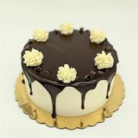 The Butler Cake · Chocolate cake, white chocolate mousse filling, vanilla buttercream, chocolate ganache.