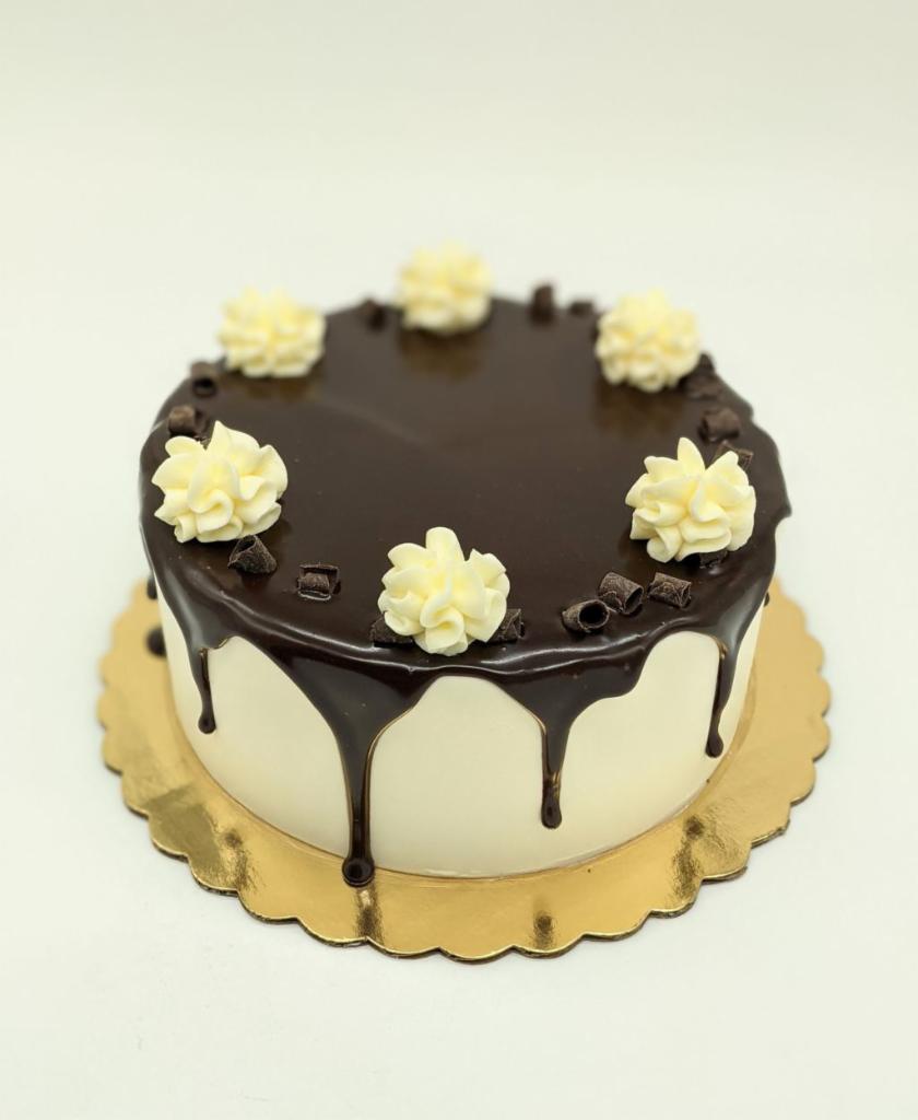The Butler Cake · Chocolate cake, white chocolate mousse filling, vanilla buttercream, chocolate ganache.