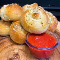 Garlic Knots  · 6 pieces. Homemade dough cut into strips, tied into knots and baked. Butter garlic sauce and...