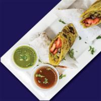 Chicken Kathi Roll · Marinated, Boneless Chicken Tikka Wrapped in 
Paratha Bread with House Masala & Sauces