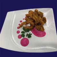 Fish Koliwada · Fish Fillet Coated with Chef’s Special Batter
& Cooked to Perfection