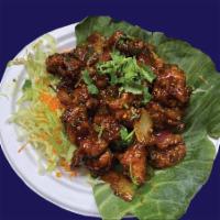 Chilli Chicken · Crispy Chicken Tossed with Onions, Bell Peppers
& Chef’s Special Sauce