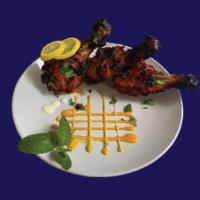 Chicken Wings (6 Pcs) · Crispy Chicken Wings Marinated in Indian Spices
& Grilled in a Clay Oven Tandoor