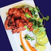 Chicken Tikka · Boneless Chicken Cubes
Marinated in Chef’s Special 
Blend & Cooked to Perfection