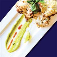 Malai Kabab · Mouthwatering Grilled Chicken Cubes Marinated
with Vegetables, Spices & Fresh Cream