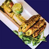Chicken Seekh Kabab · Skewered & Layered Chicken, Flavored with
Aromatic Spices & Herbs with Creamy Stuffing