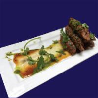 Goat Seekh Kabab · Skewered & Layered Goat, Flavored with
Aromatic Spices & Herbs with Creamy Stuffing