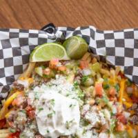 Carne Asada Fries · Fries with cheddar cheese sauce, beef, cotija cheese, pico de gallo, guacamole salsa & sour ...