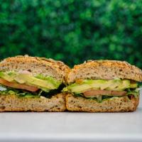 Avocado Toast Sandwich · Sourdough multigrain with Avocado, Arugula, pickled red onion, tomato and cucumber with citr...