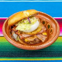 Hamburgresa Mexicana con Papas · 1/2lb Patty, Cheese, Bacon, Lettuce, Tomatoes, Pickles, Pineapple, Ham, Jalapenos, Randy Sau...