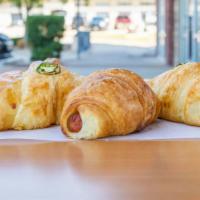 Croissant Sausage Rolls · Served with cheese.