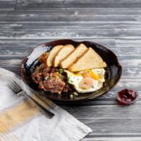 Corned Beef Hash and Eggs · Served with 3 eggs.