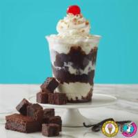 Fudge Brownie Delight Sundae · Sweet Cream ice cream, fudge brownies, hot fudge, whipped cream, chopped peanuts and cherry.