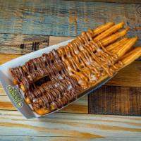 TwistMania · Irresistible combination of freshly made churros glazed with the most delicious topping of y...