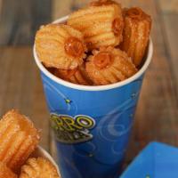 Churro Bites Filled · Delicious churro bites covered in sugar and filled with your favorite topping. 16 oz cup.