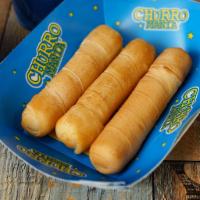 Tequeños Jumbo · Cheese filled sticks and wrapped in sheet of dough. 4 pc