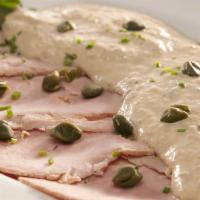 Vitello Tonnato   · Oven Roasted Pink Veal Loin Sliced and Topped with a
Tuna, Mayonnaise Sauce and Capers Berri...
