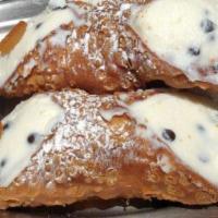 Cannolo  Siciliano · 
Homemade CannoliShell  Stuffed w/ Buffalo Ricotta, Chocolate Chips and
Dipped in Bronte Pis...