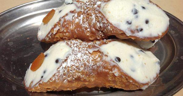 Cannolo  Siciliano · 
Homemade CannoliShell  Stuffed w/ Buffalo Ricotta, Chocolate Chips and
Dipped in Bronte Pistachios
