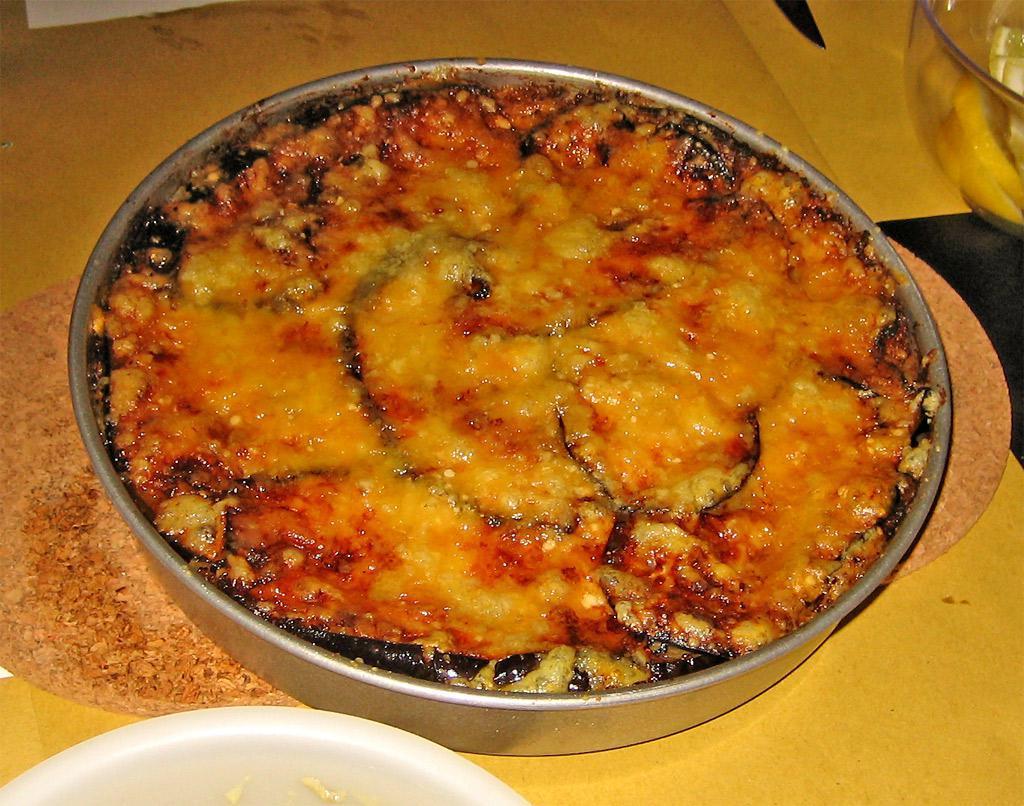 Melanzane alla Parmigiano Rivisitata	 · Oven baked eggplant, san marzano tomato, parmigiano cheese, mozzarella, basil