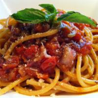 Spaghettone all Amatriciana Rossa · Thick Tonnarelli Tossed with Caramelized Onions, Pancetta Tomato Sauce and Topped w/ Pecorin...