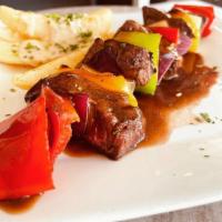 Filet Mignon Kebob · 9 oz Certified Angus Marinated Filet Mignon skewered With Peppers & Onions.