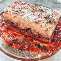Pastitsio · A Greek version of lasagna. Greek-style ziti pasta, seasoned chopped meat and a creamy becha...
