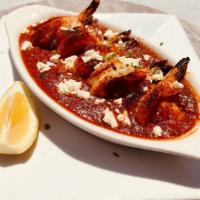 Shrimp Saganaki · Broiled jumbo shrimp with tomato sauce, fresh herbs and topped with feta