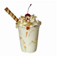 Mango con Crema · Mangos and cream topped with whipped cream and choice of granola, almonds, or pecans.