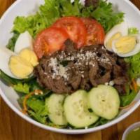 Steak Salad · House salad topped with boneless sliced
rotisserie chicken or sliced steak, sliced
tomatoes,...