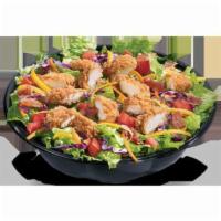 Crispy Chicken Salad · Our signature chicken strips, served hot and crispy, diced, and placed on a crisp blend of r...