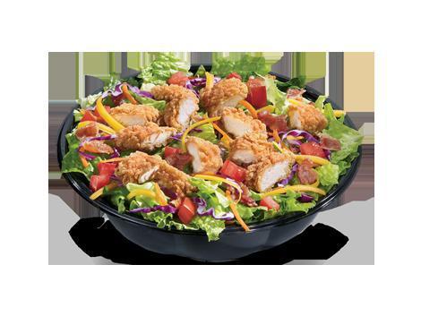 Crispy Chicken Strips Salad Bowl · Served with your choice of dressing and topped with crispy chicken, chopped tomatoes, crispy bacon bits and shredded cheddar cheese. 
