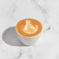 Cortado ·  Made with a double espresso and lightly textured steamed milk, 5oz.