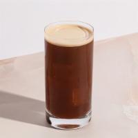Iced Americano · Double espresso, poured over cold water, and finished with ice.