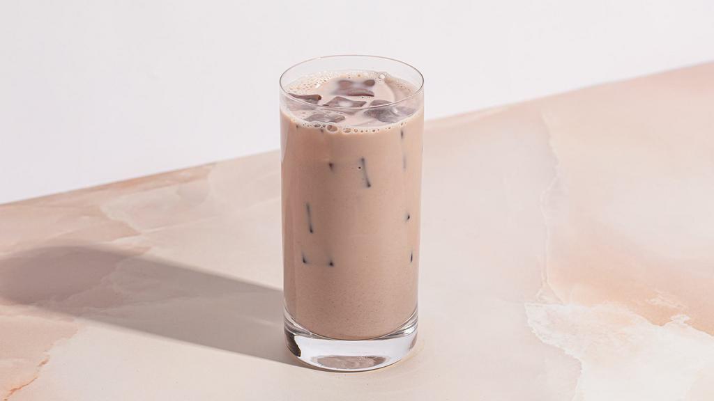 Iced Chai Latte · Aromatic spiced black tea blended with milk over ice.