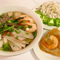 Mi Lacay · Egg noodle soup with ground pork, sliced Chasiu pork, shrimps, calamari, fish balls, pork li...